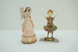 lot 144 image: Dancing cow figure and angel music box