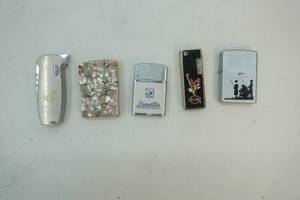 lot 241 image: variety of vintage lighters