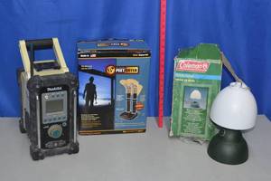 Makita radio untested needs battery,  boot warmer appears new and Coleman lamp