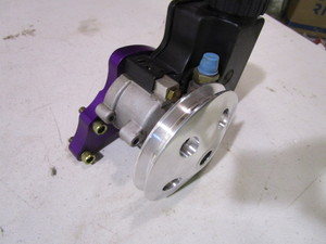 lot 114 image: (New) Power Steering Pump & Mount