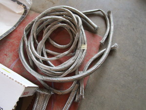 lot 346 image: Steel Braided Hose Sleeve, Oakley Lenses, Soft Sided Masking Tape, Misc. Automotive Parts