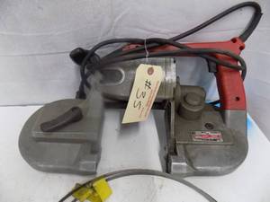 lot 89 image: Milwaukee Band Saw with 2 Blades