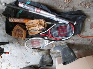 Box of sports equipment. Tennis rac...
