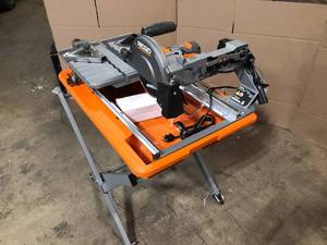 RIDGID 9 Amp Corded 7 in. Wet Tile Saw with Stand Customer Returns See Terms on Auction