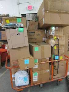 Cart of Assorted UnsoldUnclaimed I...