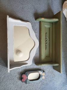 Two Hanging Shelves And A Decorative Mirror