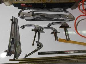 Coleman camp stove, insulators, vintage car parts, triangle road sign , extension cord and more