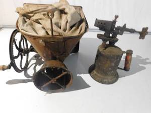 Antique seeder and torch