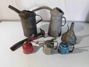 Oil cans and funnel