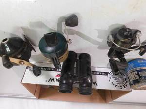 Box of reels, binocculars, sinkers and more