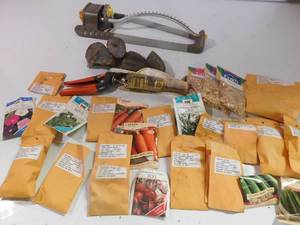 Vegtable & flower seeds, sprinkler, rocks, and grass cutters