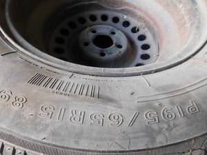 4 matching tires and 1 tire and rim