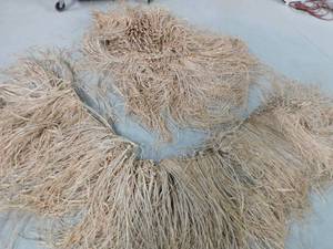 Straw skirt for duck hunting boat