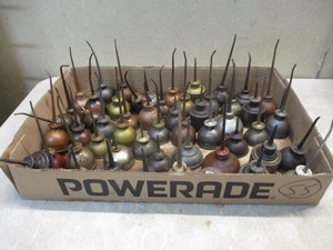 lot 112 image: 55 mini oil pumper cans