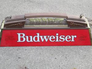 lot 203 image: Hanging Budweiser light with the Cl...