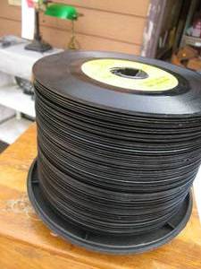 lot 37 image: Vintage case topped with 45 records...