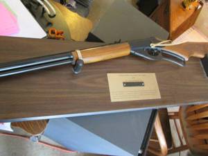 lot 109 image: NRA Daisy bb gun with wall rack...