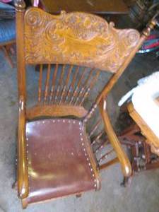 lot 114 image: Antique wood rocking chair with orn...