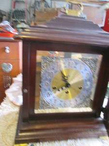 lot 116 image: Howard Miller clock with key...