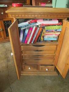 lot 129 image: Wood holder filled with books measu...