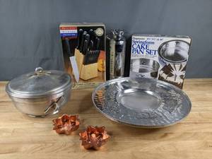 lot 130 image: Collection of Kitchen and Baking Items New Knife & Block Set, New Springform Pan Set, Aluminum Cake Pans, Pedestal Serving Platter and Nasco Italy Hammered Silver Ice Bucket Z
