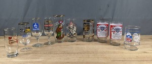 lot 125 image: Lot of 10 Vintage Beer Glasses Budweiser, NFL, Taxis Pils, Franken Brau, Elbschloss Bier, The Chipettes, Newfoundland Labrador, and More Z