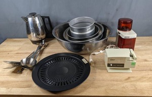 lot 129 image: Assortment of Vintage Kitchen Gadgets Korean BBQ Grill Plate, Flavo-Perk Percolator, Oster Knife Sharpener, Waring Coffee Grinder, Mixing Bowls, Serving Utensils Z