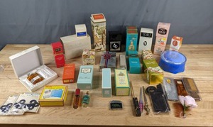 lot 115 image: Vintage Personal Beauty Items - Colognes (Avon, Estee Lauder, and more), Luggage Rollers, Nail Files, Combs, Oil of Olay Creams Z
