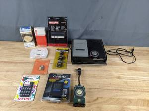 lot 102 image: Calculators, Padlocks, Light Timers, Casio Travel Clock, Vintage Panasonic Solid State Tape Recorder, and more Z