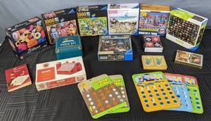 lot 168 image: Collection of Games and Puzzles Road Trip Bingo, 1000 & 500 Piece Puzzles, Texas Holdem Poker Set, Outdoor Bingo and More X