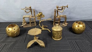 lot 162 image: A Collection of Metal Bookends, Candle Holders and a Jar  X