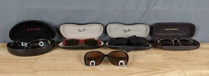 lot 245 image: Sunglasses by Ralph, Ray-Ban, Banana Republic, and Kirkland X