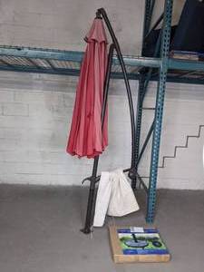 lot 309 image: Patio Umbrella on a Stand and Freestanding 36 Lb. Umbrella Base  X