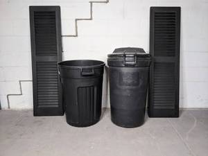 lot 322 image: (2) Black Shutters and (2) Black Trash Cans X