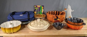 lot 351 image: Bunt Cake Pans, Pumpkin Carving Kit, Large Orange and Black Halloween Punch Bowl, Pyrex Carrying Bag, Light Up Ghost Decoration and More  W