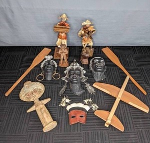 lot 344 image: A Collection of Wood, Leather and Metal Faces and People Statues  W