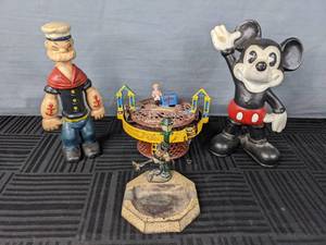 lot 345 image: Vintage Cast Iron Ashtray, Popeye and Mickey Mouse Piggy Banks, Mechanical Horse Race Cast Iron Bank  W