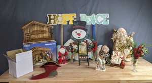 lot 368 image: Christmas Decor Nativity Set, Gold Santa Tree Topper, Normal Rockwell Figurine, Ceramic and Metal Decor, and More  W
