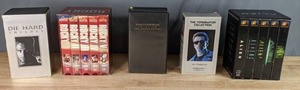 lot 374 image: VHS Movie Sets  Die Hard Trilogy, Rocky I-V, Halloween Limited Edition, Terminator 1 & 2, The Alien Legacy  W