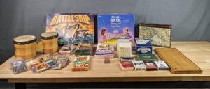 lot 395 image: Assortment of Games Pokemon & Yu-Gi-Oh Trading Cards, Battleship, Foam Dominoes, Skip-Bo, Bee Playing Cards, Men Are From Mars Women Are From Venus The Game and More W