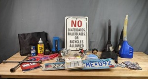 lot 396 image: Ozark Trail Hand Light, Funnels with Flexible Spout Extensions, Minnesota License Plates, No Skateboards Roller Blades Bicycles Allowed Sign and More W