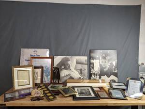 lot 387 image: A Collection of Various Sized Picture Frames, Audrey Hepburn Portrait, James Dean Portrait and D Mortimer Luther Sketch  W