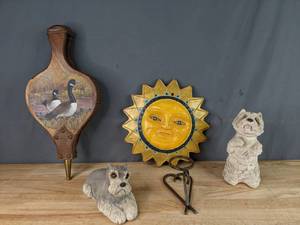 lot 60 image: Hand-Crafted Duck Painted Air Blower, Sun Faced Wall Plaque, (2) Schnauzer Dog Figurines and Hand Forged Heart and Circle  P