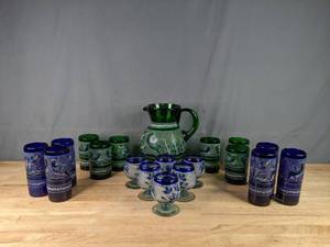 lot 32 image: A Collection of Blue and Green Glasses with Birds on Them and A Green Pitcher with Birds  P
