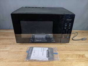 lot 494 image: Black Colored Magic Chef 1.1 Cubic Feet Countertop Microwave Oven  R