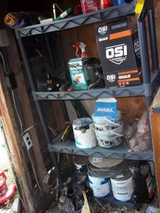 Plastic shelf filled with garage it...