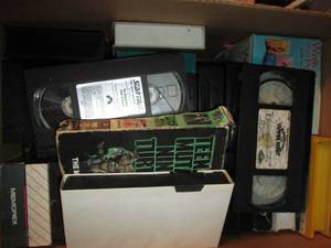 Variety box of VHS video tapes, wor...