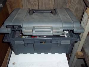 Plastic tool box filled with assort...