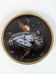 lot 73 image: The Millennium Falcon from the Star Wars Space Vehicles Plate Collection