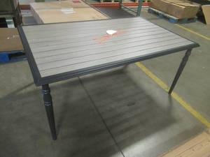 lot 503 image: Aluminum Patio Table With Umbrella Hole, Approximate Dimensions 65 x 40 X 30 Tall. In nice condition. Very light scratch on top (camera could not pick it up)